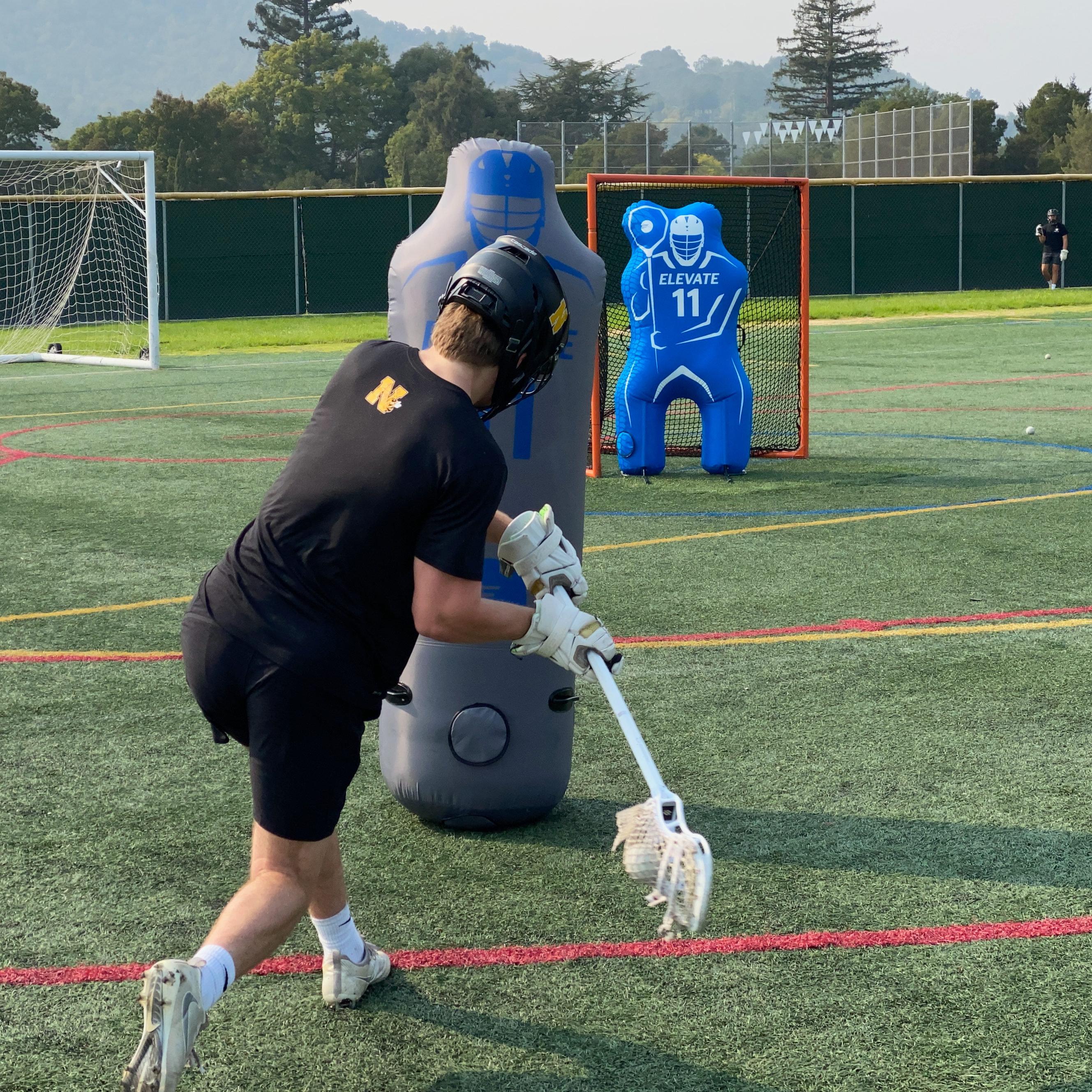 lacrosse dodging and shooting drill screen shots with the elevate dummy defender